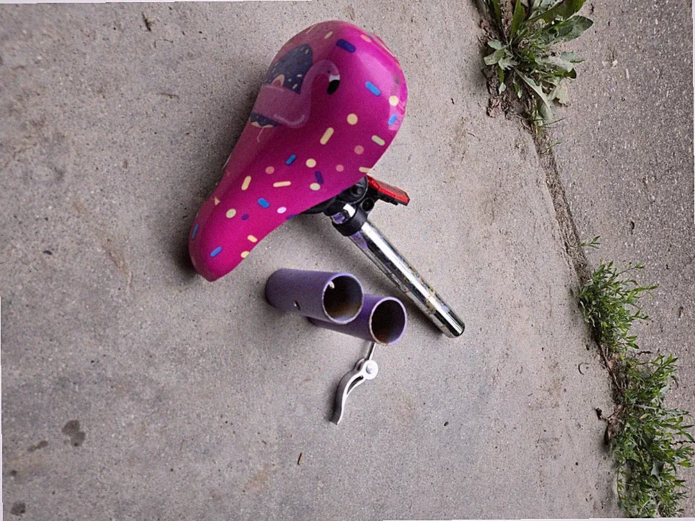 Bicycle Seat With Quick Release And Tire Pegs